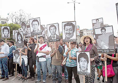 Survivors of the 'disappeared' protest in Lima